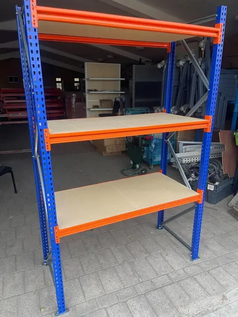 A longspan racking bay with three chipboard levels.
