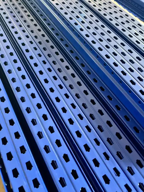 Rows of blue perforated uprights.